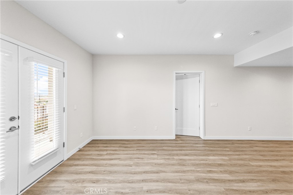 419 North Chandler Avenue, Unit 412 Monterey Park, CA 91754 - Photo 5 of 25 a view of empty room with wooden floor and fan