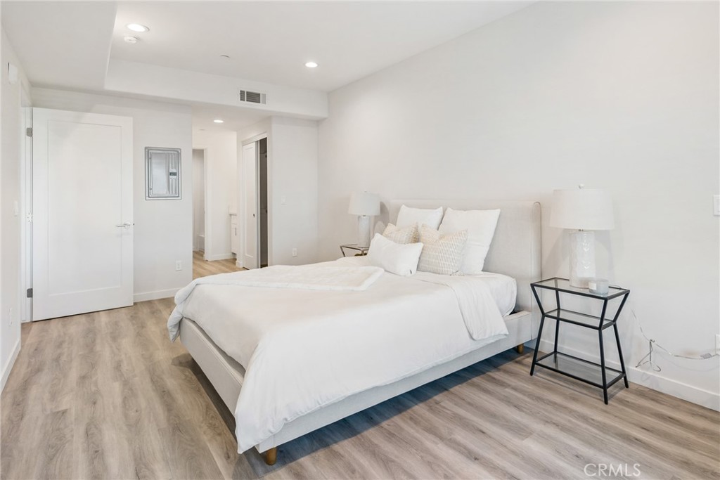 419 North Chandler Avenue, Unit 412 Monterey Park, CA 91754 - Photo 10 of 25 a bedroom with a bed and a table