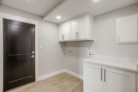 a view of cabinets and wooden floor