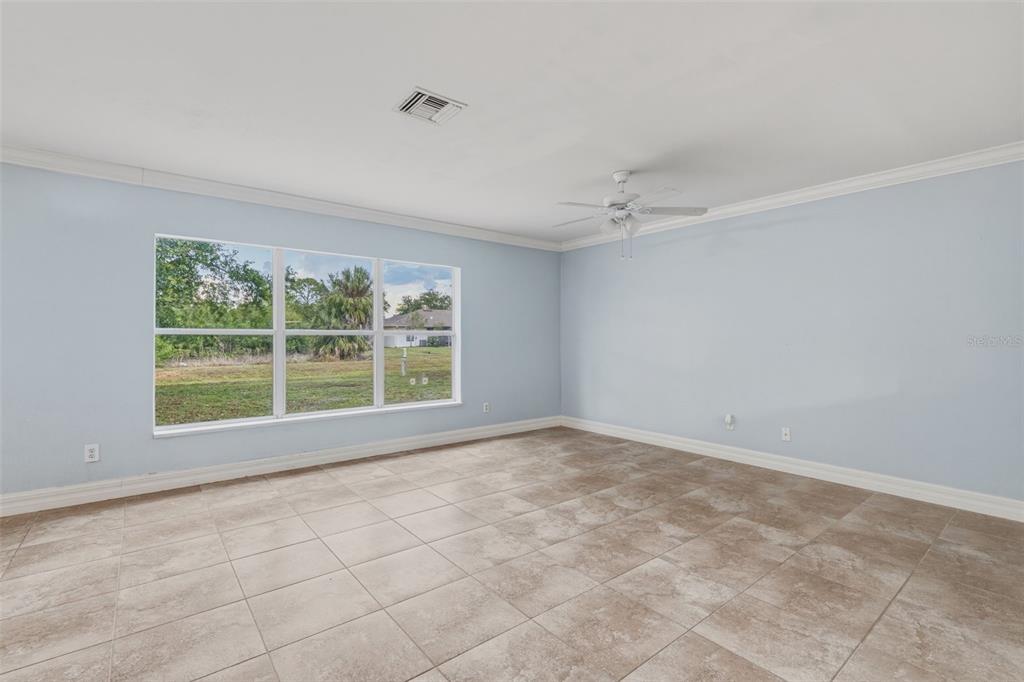 25134 Palisade Road Punta Gorda, FL 33983 - Photo 13 of 58 a view of an empty room with a window
