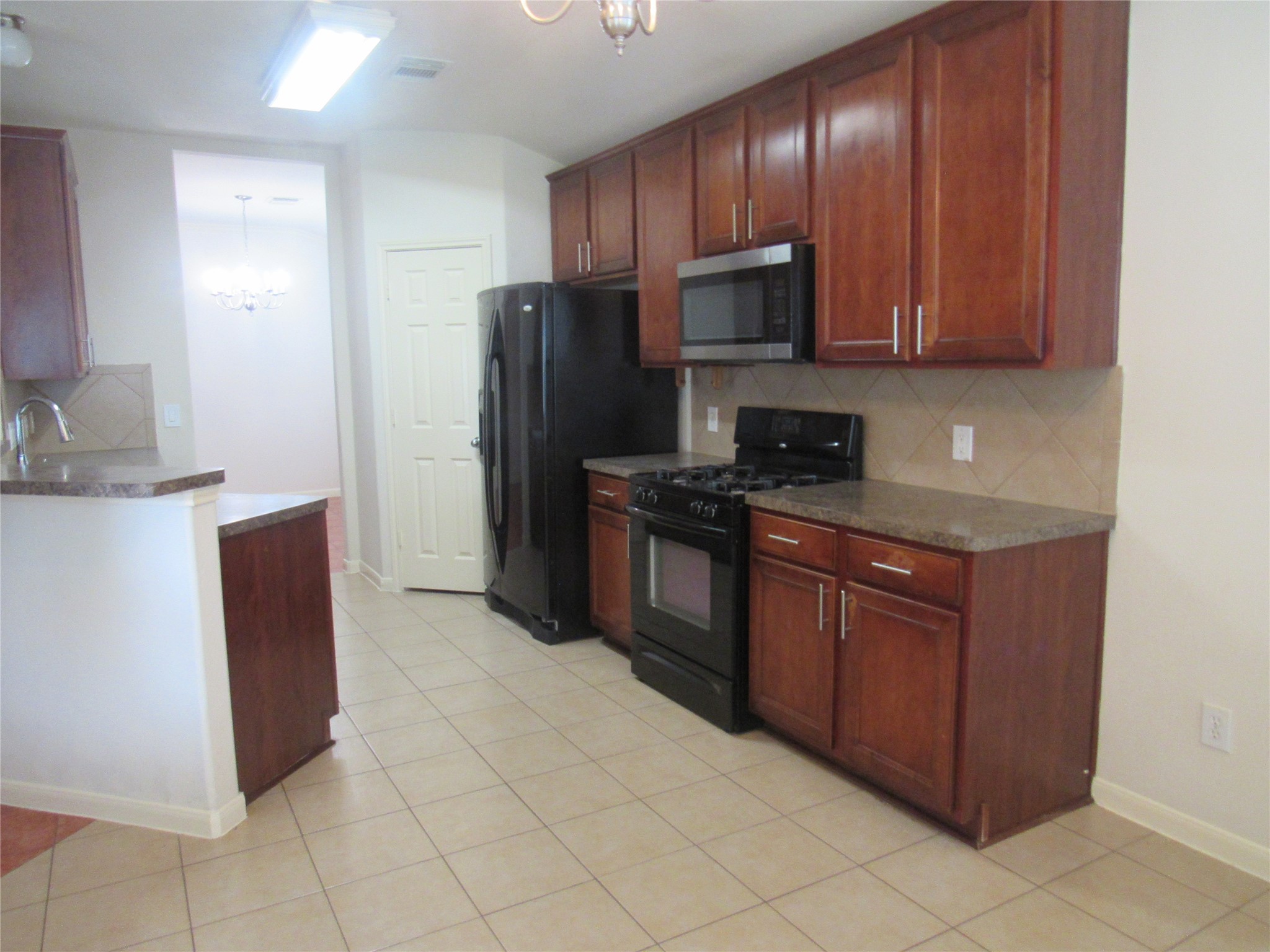 2611 Colony Haven Circle Spring, TX 77373 - Photo 4 of 18 The kitchen has black appliances