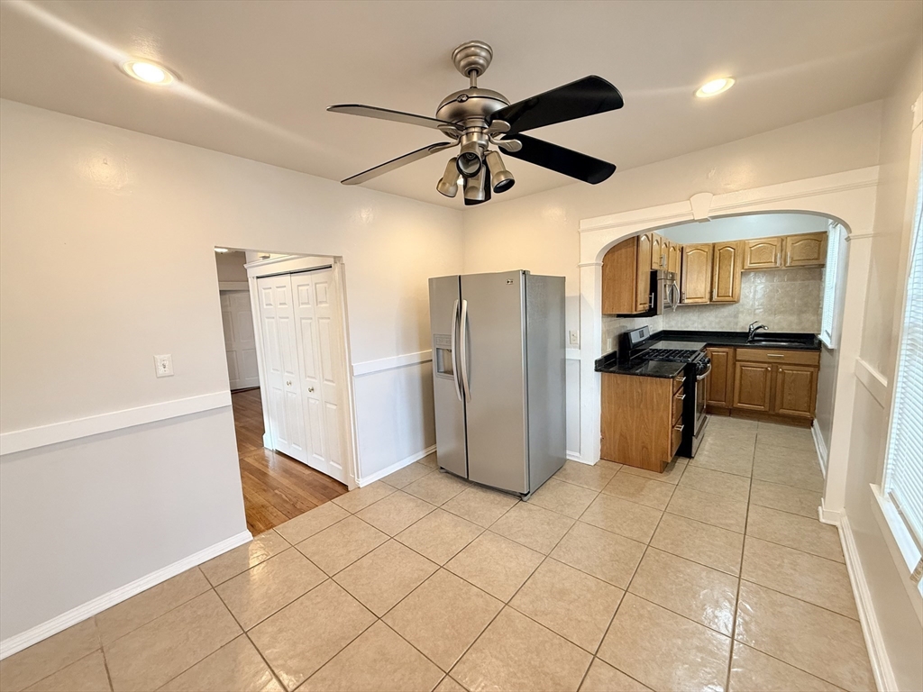 49 Favre Street, Unit 2 Boston, MA 02126 - Photo 15 of 22 a kitchen with stainless steel appliances a refrigerator and microwave