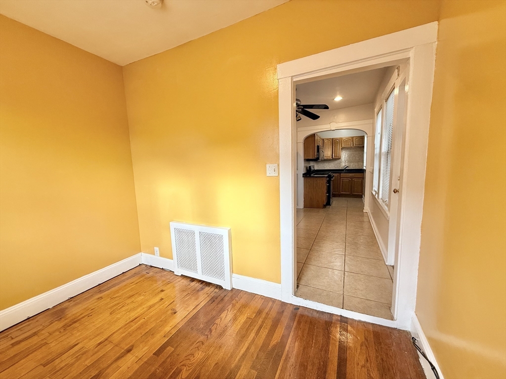 49 Favre Street, Unit 2 Boston, MA 02126 - Photo 19 of 22 a bathroom with a sink and a mirror