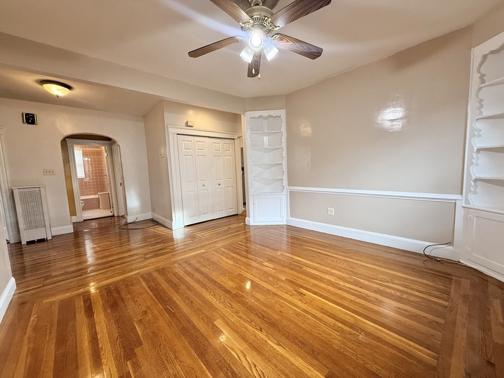 49 Favre Street, Unit 2 Boston, MA 02126 - Photo 2 of 22 a view of empty room with wooden floor