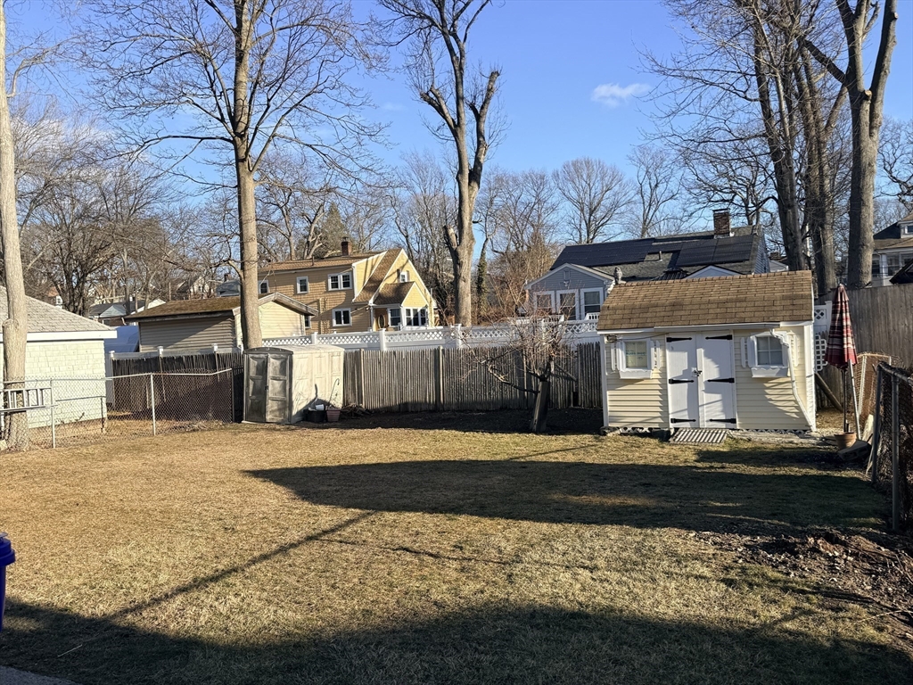 49 Favre Street, Unit 2 Boston, MA 02126 - Photo 22 of 22 a front view of a house with a yard and garage
