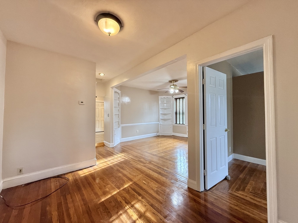 49 Favre Street, Unit 2 Boston, MA 02126 - Photo 4 of 22 a view of empty room with wooden floor