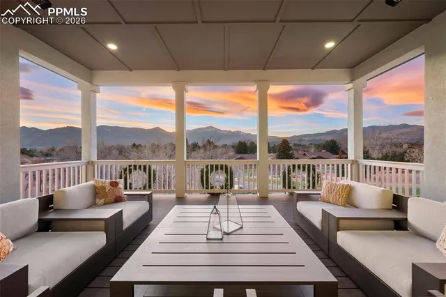 a balcony view with a couches and city view