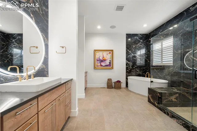 a view of a kitchen with furniture and a large window