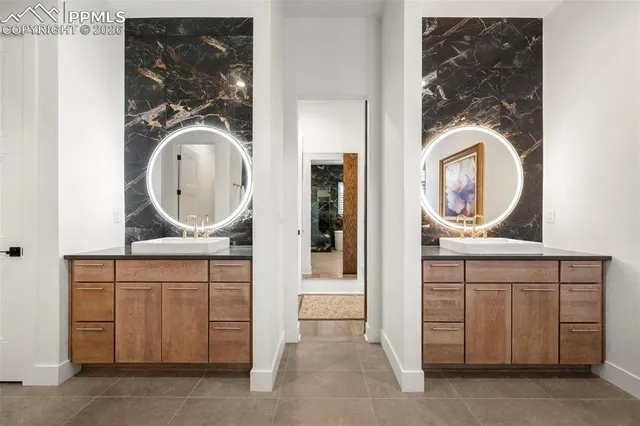 a bathroom with a sink a mirror and a vanity