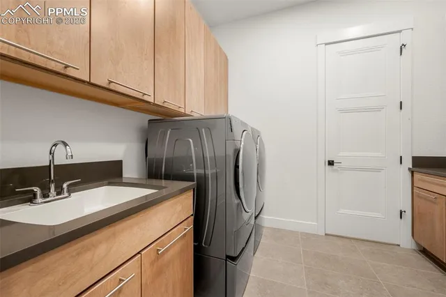 a kitchen with stainless steel appliances granite countertop a sink and a refrigerator