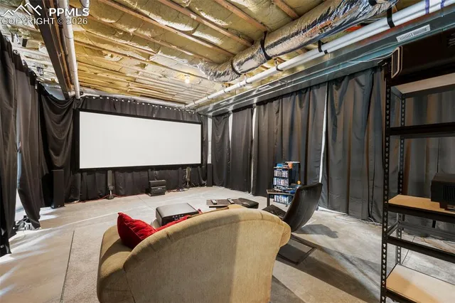 a bed room with a bed and a flat screen tv