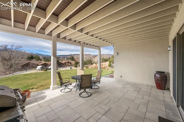 a view of a swimming pool and lounge chairs