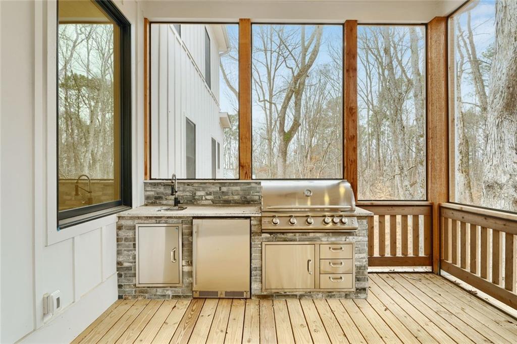 555 Lower Birmingham Road Canton, GA 30115 - Photo 60 of 104 a view of a kitchen with a window and wooden floor