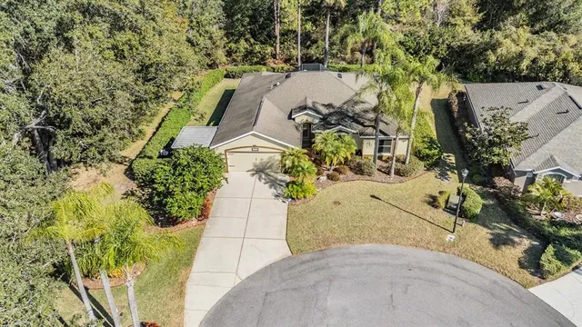a sign that is sitting in front of flowers