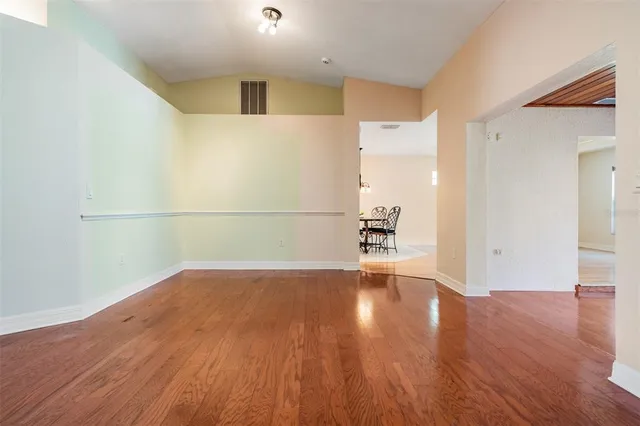 a view of a kitchen with furniture and a potted plant