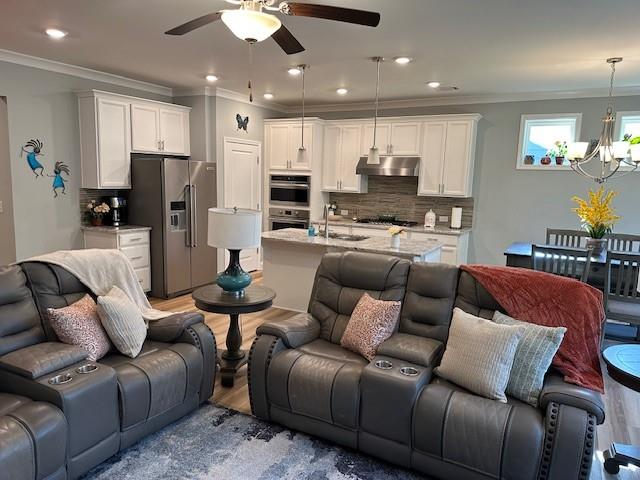 513 Forest Lane Canton, GA 30114 - Photo 21 of 54 a living room with furniture kitchen and a chandelier