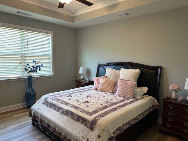 513 Forest Lane Canton, GA 30114 - Photo 28 of 54 a bedroom with a bed and a chandelier