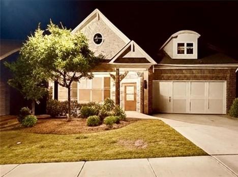 513 Forest Lane Canton, GA 30114 - Photo 3 of 54 a front view of a house with garden