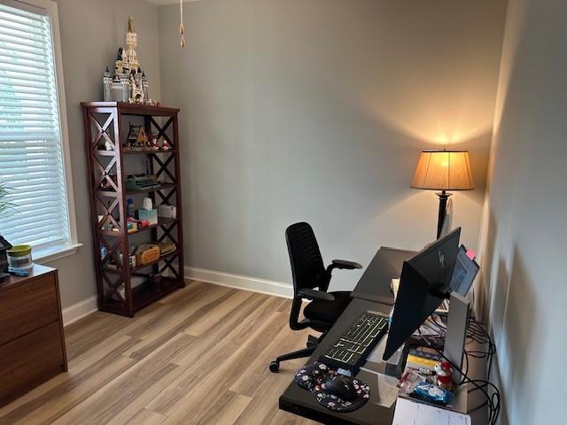 513 Forest Lane Canton, GA 30114 - Photo 33 of 54 a view of a workspace with furniture and a wooden floor