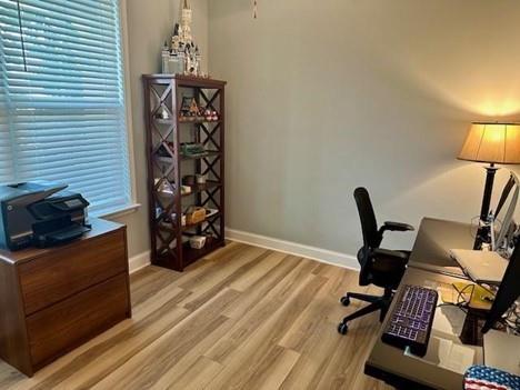 513 Forest Lane Canton, GA 30114 - Photo 35 of 54 a view of a workspace with furniture and wooden floor