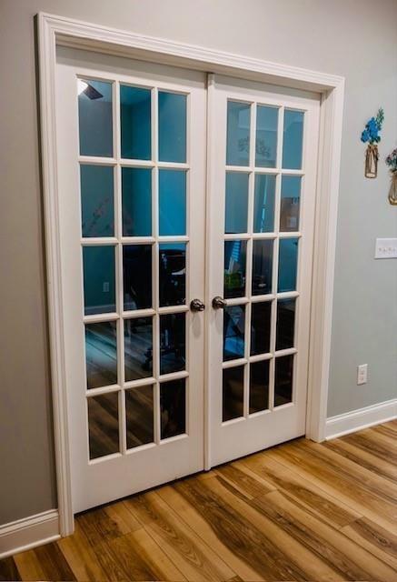 513 Forest Lane Canton, GA 30114 - Photo 36 of 54 a view of an empty room with wooden floor and windows