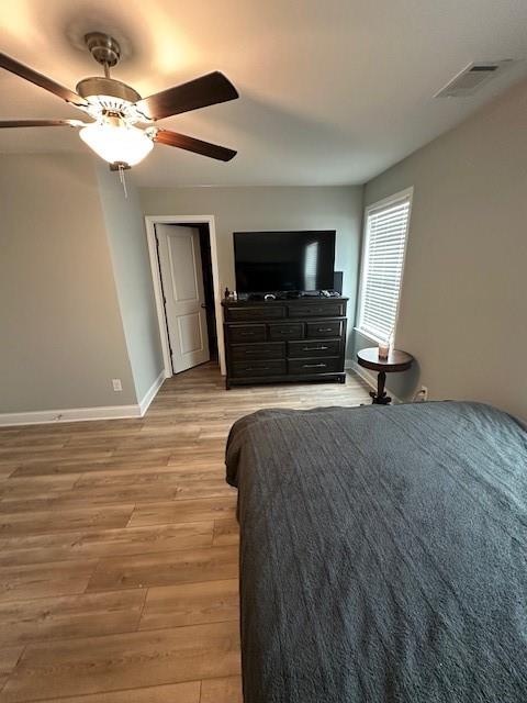 513 Forest Lane Canton, GA 30114 - Photo 44 of 54 a spacious bedroom with a bed and a flat screen tv