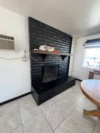 a stove top oven sitting inside of a kitchen