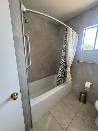 a bathroom with a bath tub and a shower