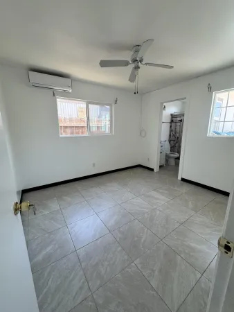 a view of an empty room with a window