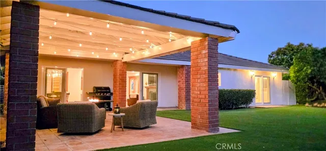 a spacious bedroom with a bed couch and a window