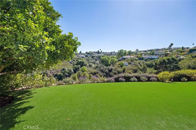 a bedroom with a large bed and a large window