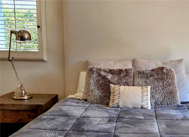 a spacious bathroom with a double vanity sink a mirror and a shower