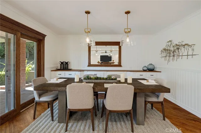a bedroom with a bed window and wooden floor