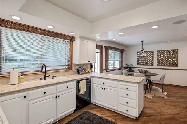 a view of a livingroom with furniture and wooden floor