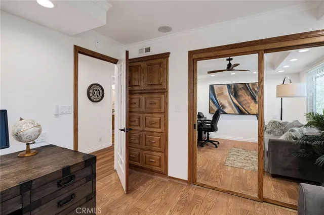 a view of a kitchen with white cabinets