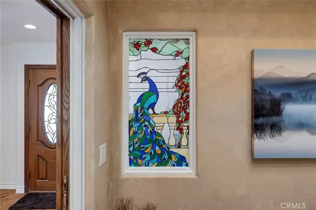 a front view of a house with a garden and yard