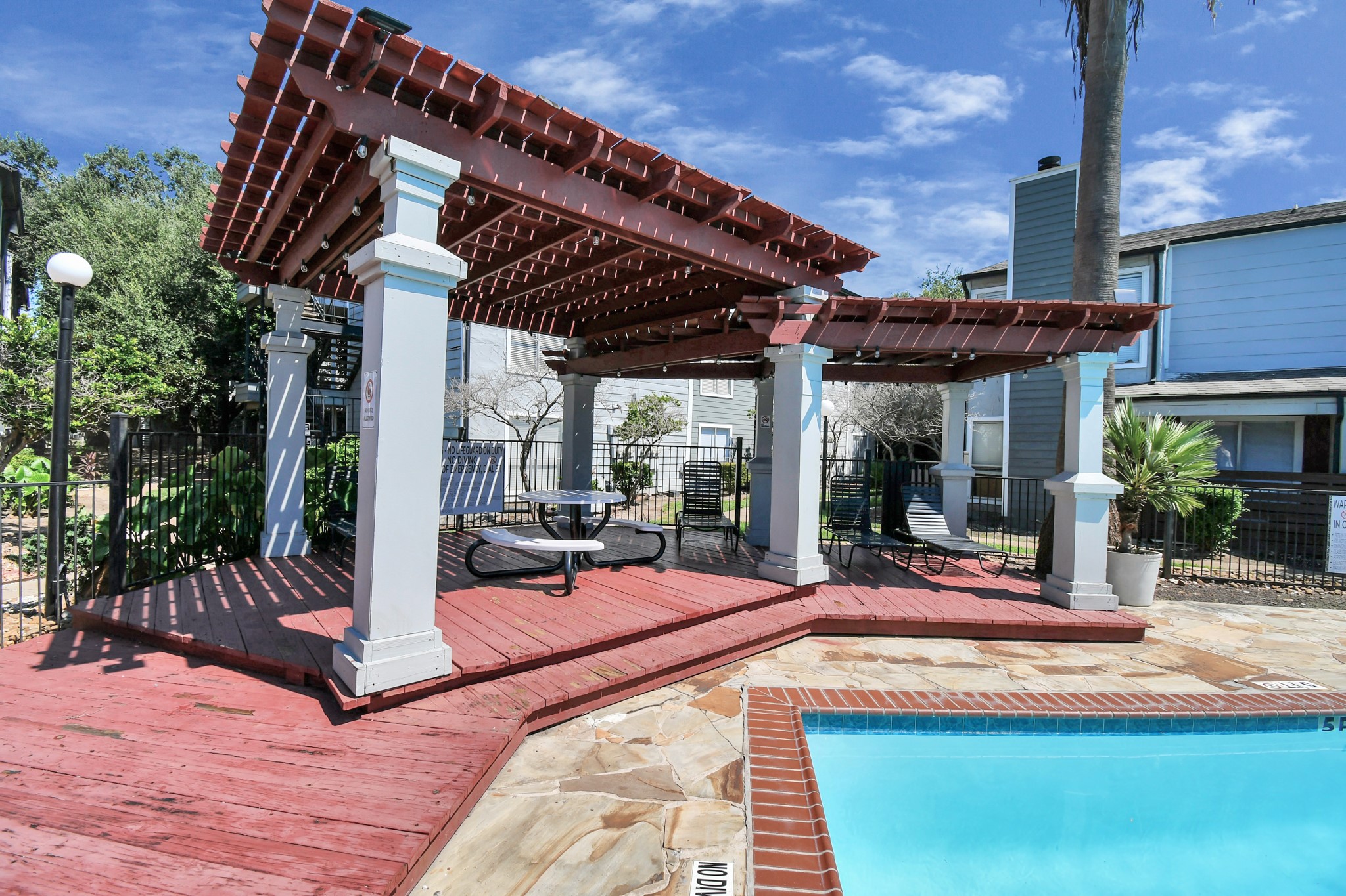 5959 Bonhomme Road, Unit 192R Houston, TX 77036 - Photo 8 of 26 a view of a backyard with a patio and outdoor seating