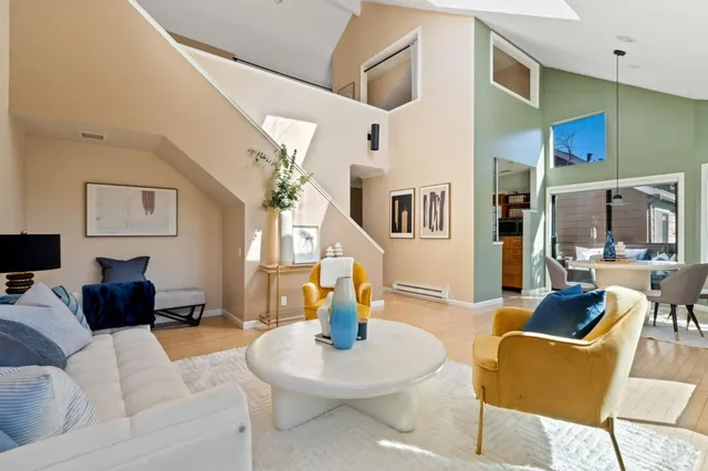 a spacious bathroom with a granite countertop sink and a large mirror