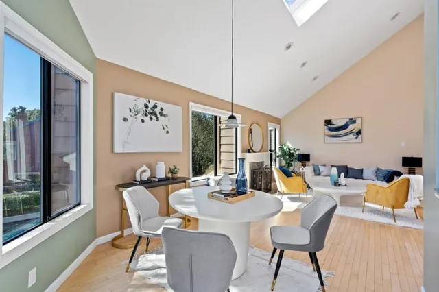 a kitchen with stainless steel appliances granite countertop a sink a stove and a refrigerator