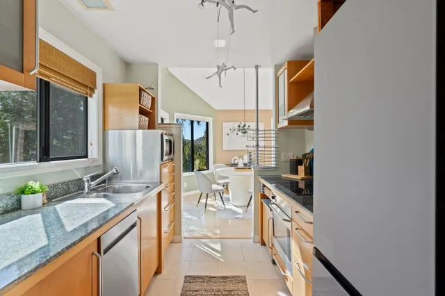 a room with a couch and a view of bathroom