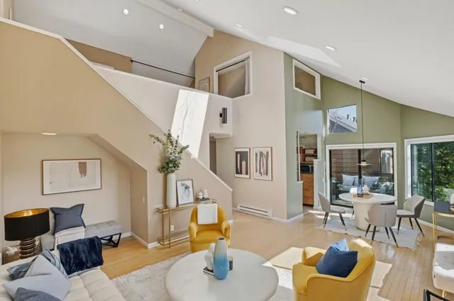 a living room with furniture and a chair