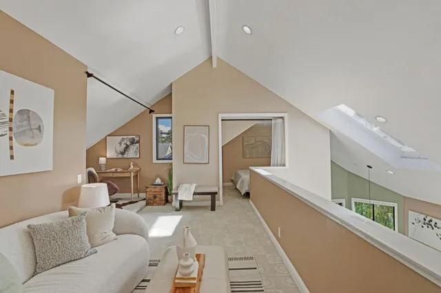 a large white bed in a white room