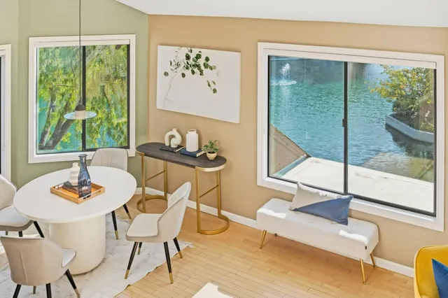 a view of a dining room with furniture window and outside view