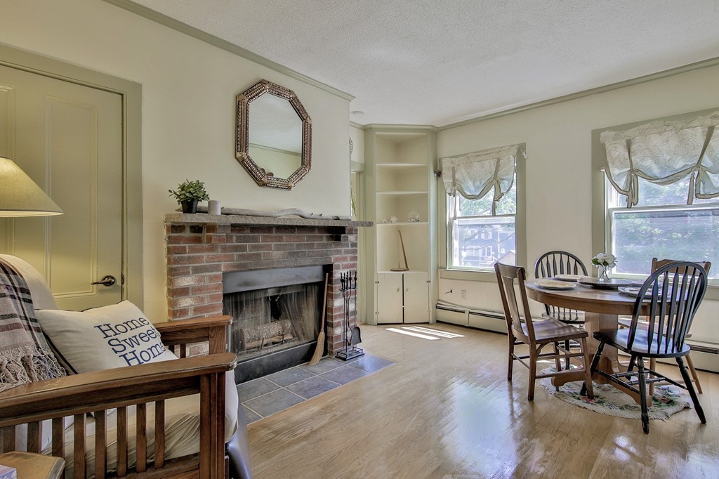 68 County Road, Unit C Ipswich, MA 01938 - Photo 2 of 13 a view of a livingroom with furniture and a fireplace