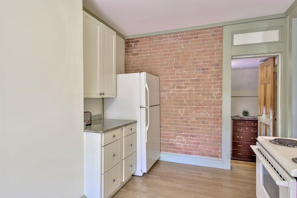 68 County Road, Unit C Ipswich, MA 01938 - Photo 6 of 13 a kitchen with stainless steel appliances a refrigerator and a stove top oven