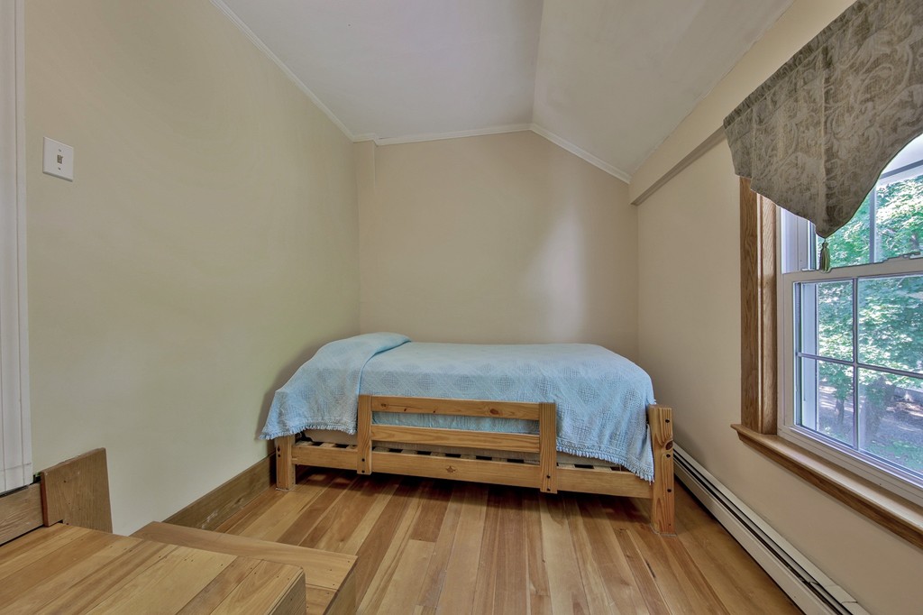 68 County Road, Unit C Ipswich, MA 01938 - Photo 8 of 13 a room with a bed and a window