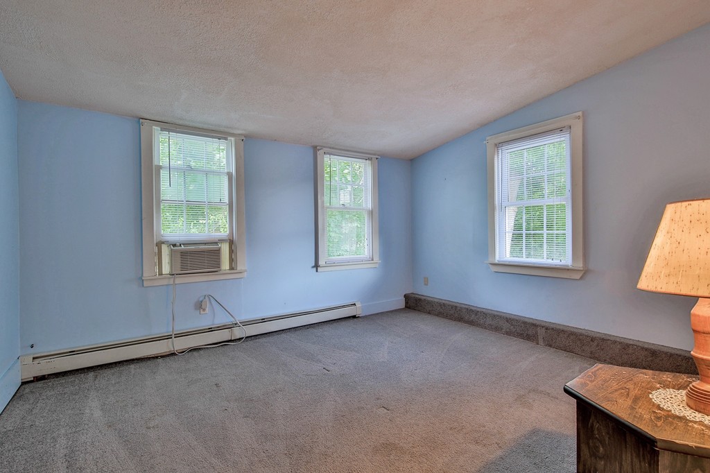 68 County Road, Unit C Ipswich, MA 01938 - Photo 10 of 13 an empty room with windows