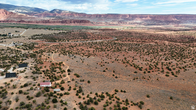 358 South Sky Drive Torrey, UT 84775 - Photo 70 of 82 Expansive desert landscape featuring natural rock formations and distant red-rock mesas