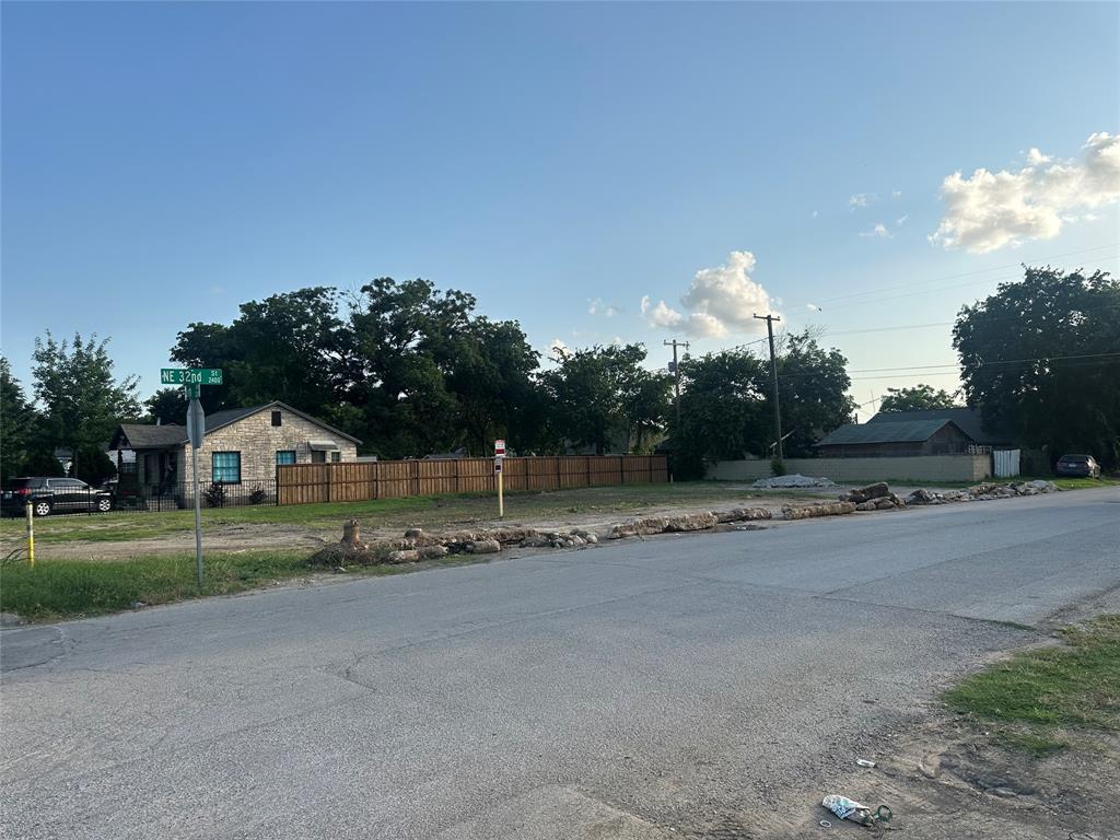 3209 Deen Road Fort Worth, TX 76106 - Photo 5 of 11 a view of a house with a big yard and a large trees