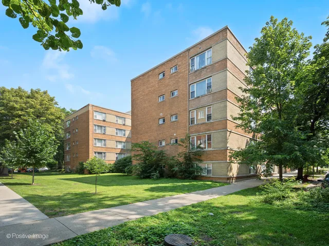 a view of a building with a yard